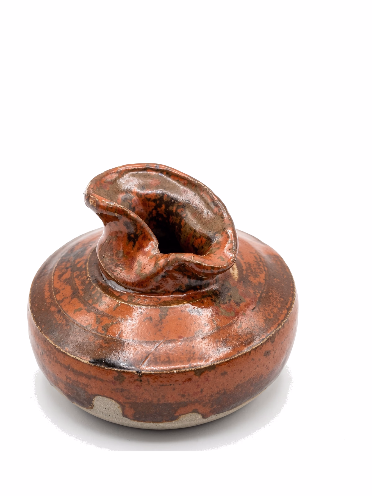 A wide low-shouldered iron-red vessel with a sculpted curled spout/lip on top.