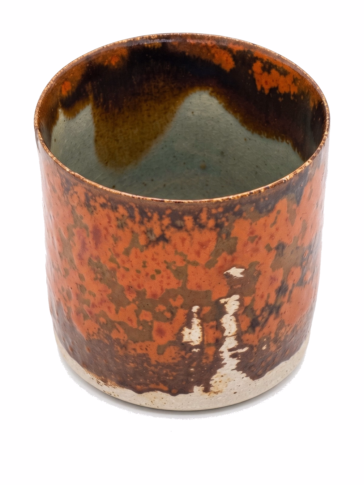 A short cylindrical vessel with mottled orange-rust iron glaze on the exterior and a softer green-grey interior.